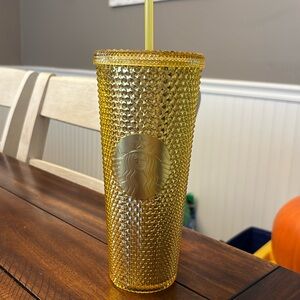 Gold Starbucks cup